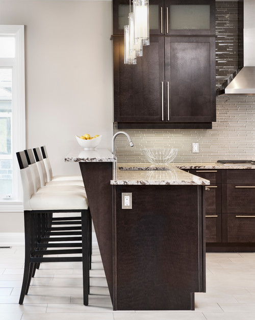 Tumbled Limestone Backsplash with Ceramic Connection with Typhoon Bordeaux Granite Countertop and Cherry Havana Stained Cabinets